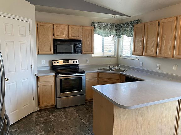 Spacious kitchen with large pantry and ample cabinet space. All shown appliances included.