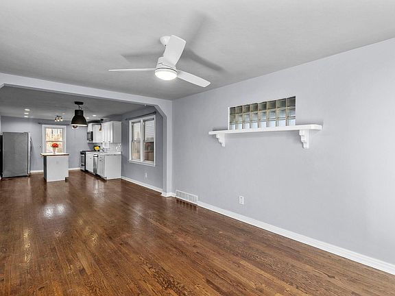 Open floorpan with dark hardwood floors