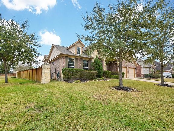 This stunning home sits on a corner lot with no backyard neighbors!