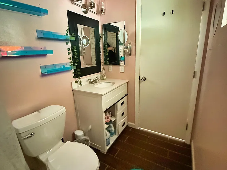 Shelves in place for storing bathroom supplies.