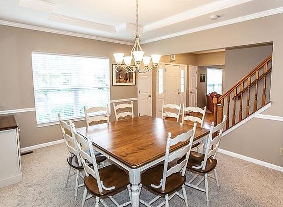 Large formal dinning room with coffered ceiling