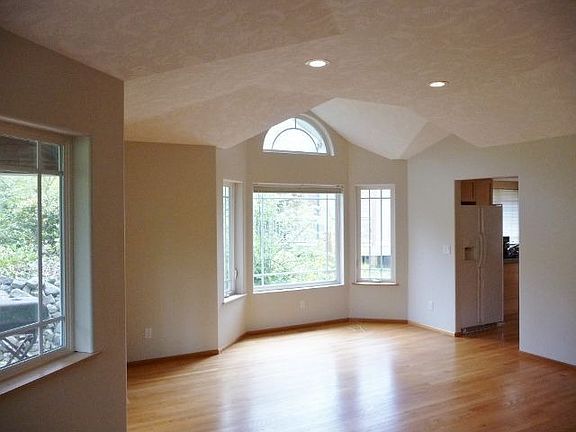 Large Living Room with Big Bay Window Dining Area