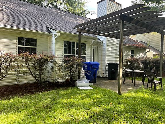back of house with pergola