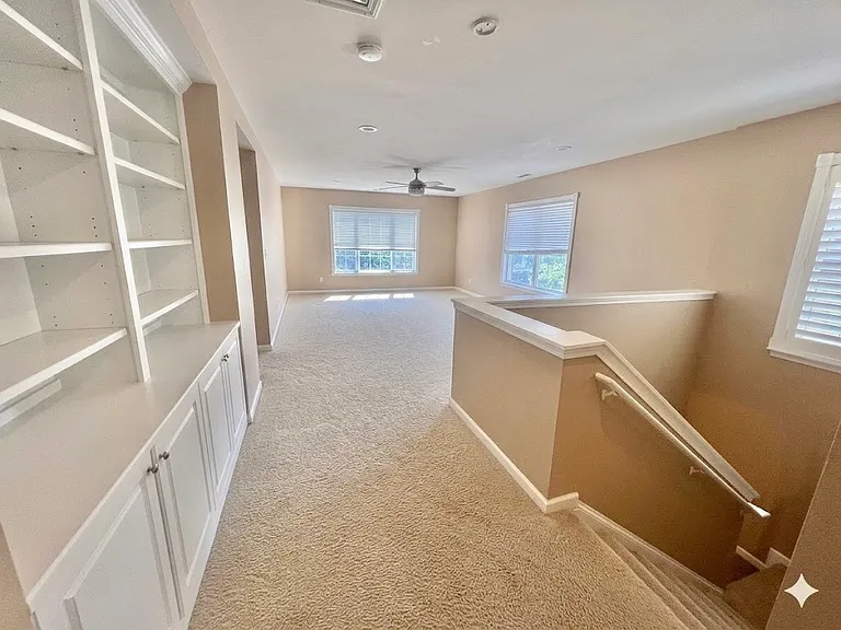 Upstairs Hallway and Loft with built in bookcase - Empty