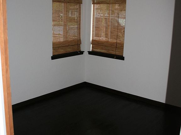 Bedroom with Black Stained Floor
