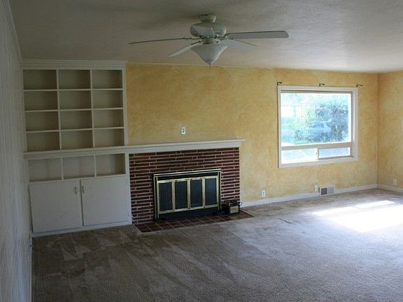Large separate family room with 2nd fireplace and built in shelves.