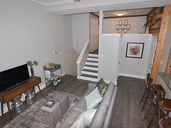 224 E 13th Street, Unit#B, Indianapolis, IN 46202. The open floor plan, tall ceiling, and brand new wood flooring highlight the great room.