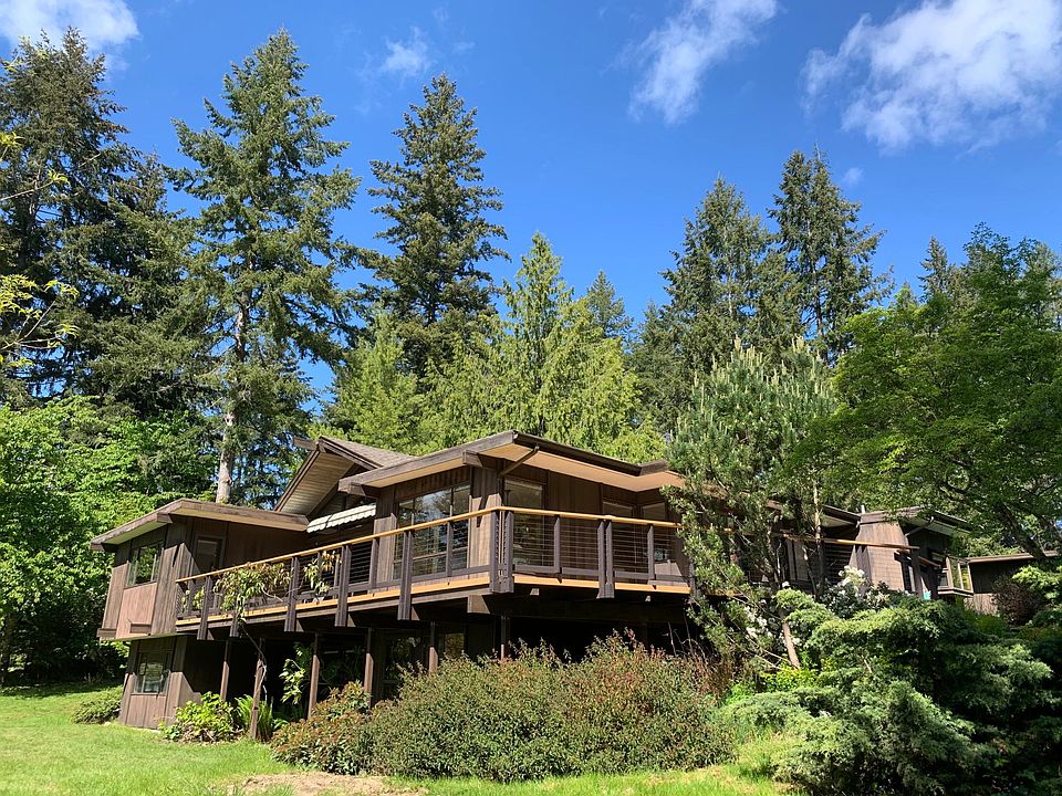 Wrap around deck with western and southern exposure to the view. Large lawn in front.