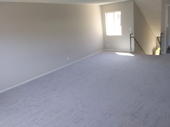 Living room facing stairs.