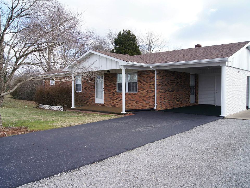 Paved drive with attached carport