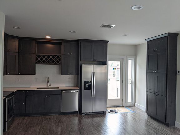 Kitchen electric range to the left in the photo