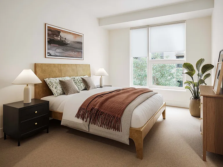 Inviting bedroom with elegant decor, featuring a cozy bed with plush pillows, ambient lighting, and a large window offering natural light.