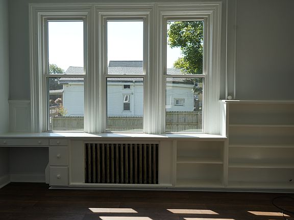 Living room built in bookshelf and desk.
