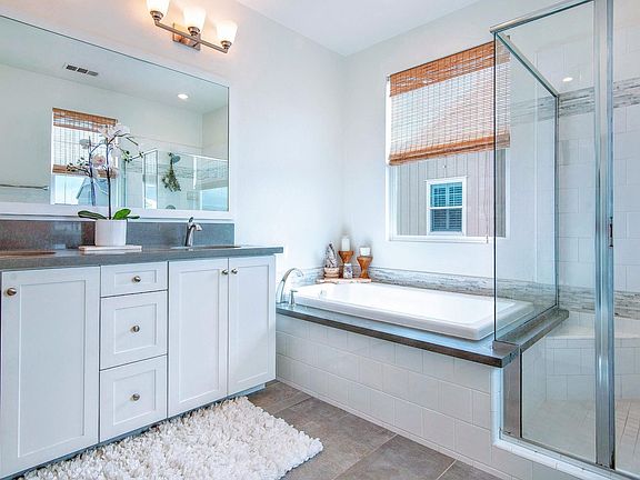 Luxurious master bathroom with dual sink vanity and soaking tub