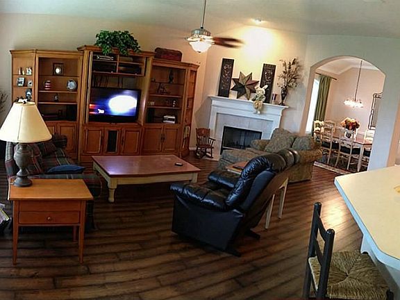 Click for Pano.Large den with laminate wood floors