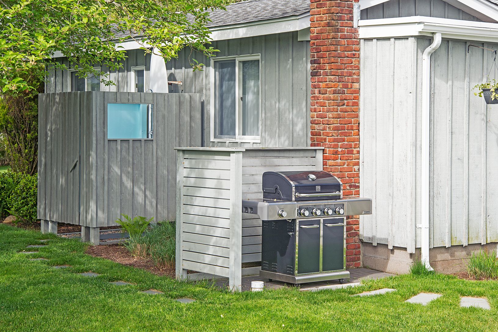 The gas grill is steps from kitchen and deck. Charcoal Weber grill is available on request