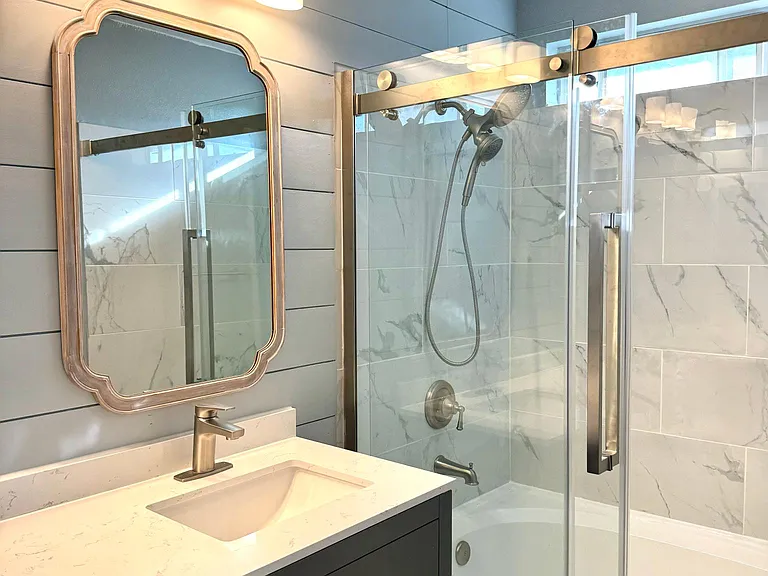 Master bathroom with glass frameless shower door (modern barn door style)
