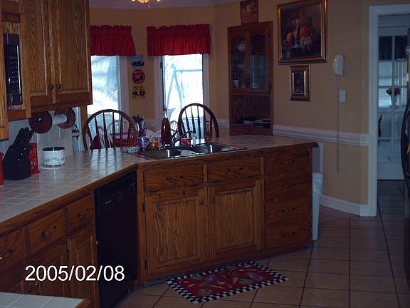 Oak custom cabinets, tile floors