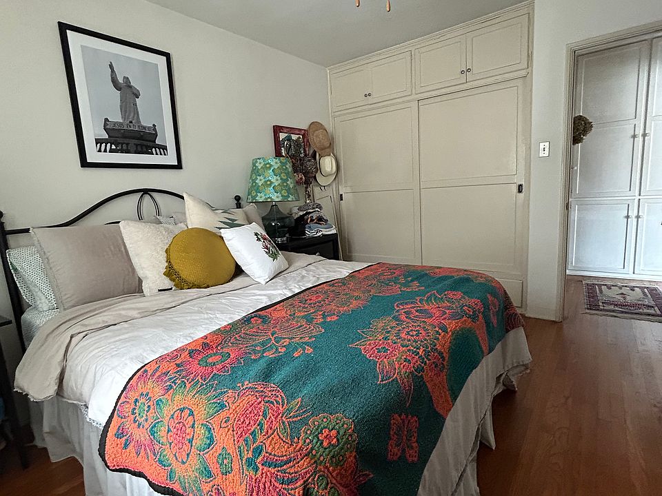 Large bedroom (queen bed in photo) with lot of closet space plus drawers below and cabinets above, linen closet in hall in right of picture). Also a walk-in closet at front door.