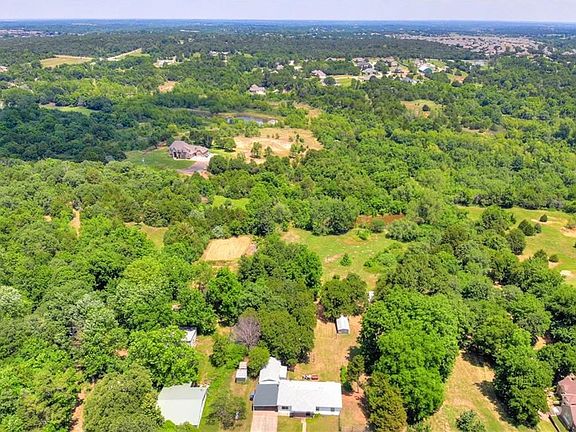 4.14 Of beautiful land.  You can see the pond at the back of the property.