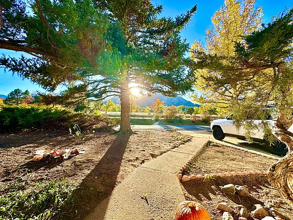View near sunset from front door. Again, the yard was just de-bushed and cleaned up so now we are going to make the front look good sans the grass we will need to grow in Spring.
