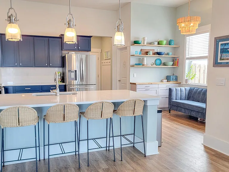 Large kitchen island with coastal navy blue cabinets