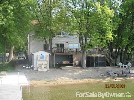 View from end of dock back at house
						:
						Sandy beach and 2 decks