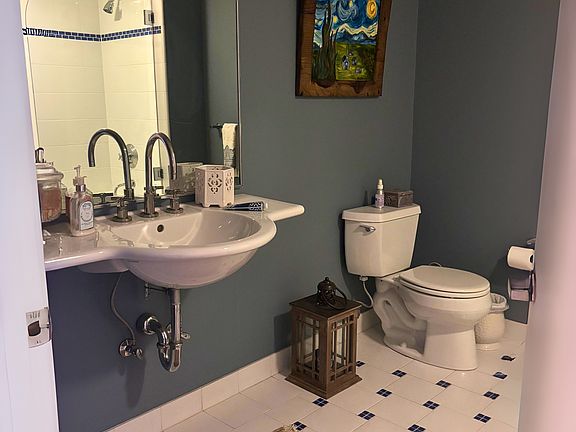 Bathroom 1, full bathroom with shower and tub.