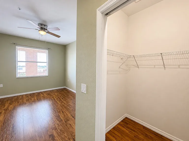 Walk-in closet located within the spacious primary suite