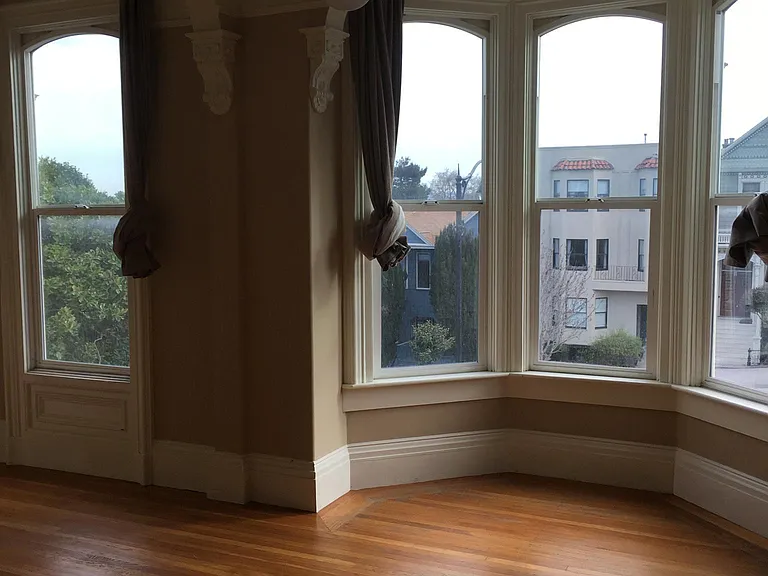 Living room with fireplace and city views