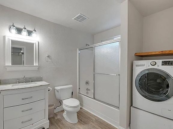 Full bath with washer/dryer combo in-unit.