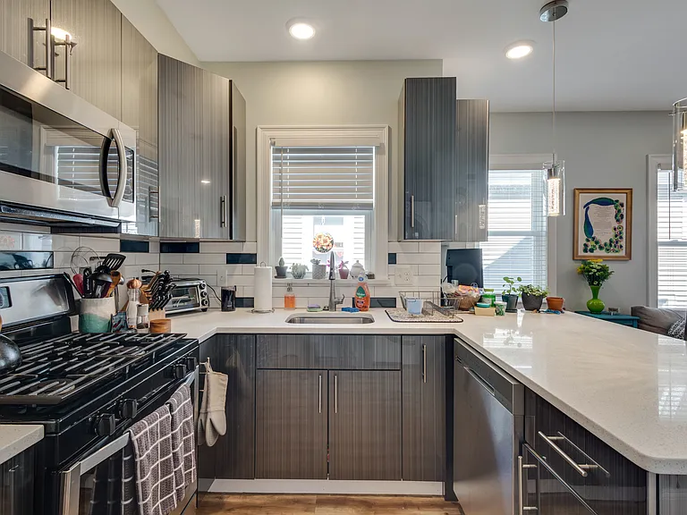 Dishwasher, vent-out microwave hood, disposal, and recycle/trash bin in cabinets