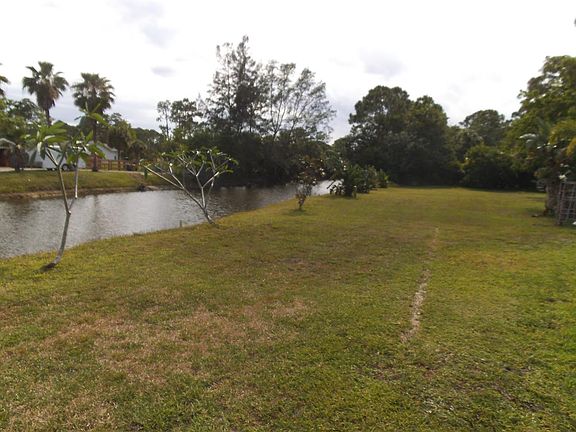 Situated on a very wide canal to the South of the