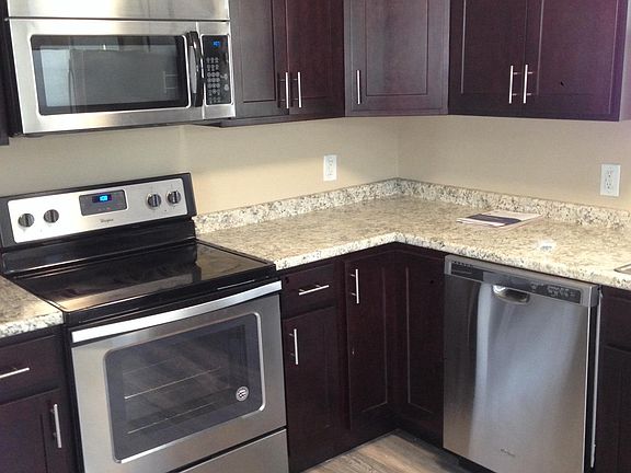 New floors, cabinets, and stainless appliances