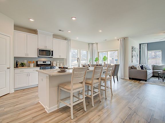Kitchen overlooks dining and family room.