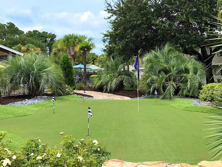 Indulge in putting practice at our serene on-site green paradise. Love where you live and moments like this to play steps from your front door.