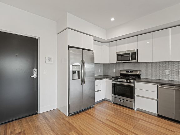 Front Entry of Apartment and Kitchen