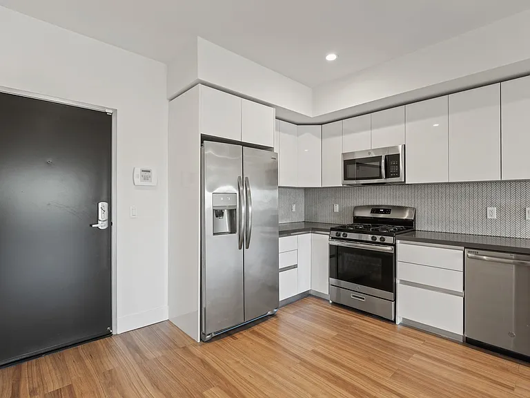 Front Entry of Apartment and Kitchen