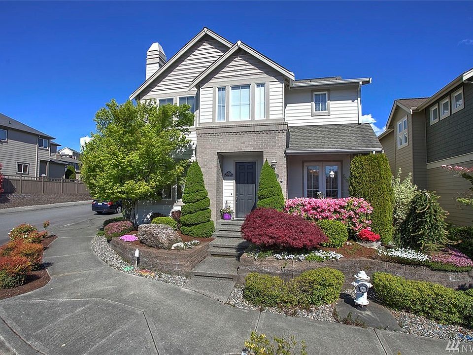 Welcome home to the lovely community of  Woodside. This spacious 4 bed, 4 bath home is sure to please. Featuring great curb-appeal, this home features elegant finish work, high ceilings, built-in cabinets, abundant windows, natural light and open spaces. You'll also appreciate the 4th bedroom: located above the garage with a half bath--great for a home office, studio or guest suite. The elegant formal living and dining rooms welcome you to this grand home, and the dining room features double doors to a covered patio. The kitchen boasts an awesome Butler's pantry, gas stove and sprawling island. Made for entertaining, the great room concept connects the kitchen, informal dining area and family room, warmed by a lovely fireplace & built-in media space. You'll be impressed by the incredible master suite with a grand entry and a luxurious ensuite bath. A main floor den features French doors and Tuscan suede paint. 
