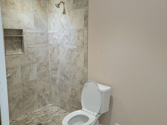 Walk in shower with ceramic tile