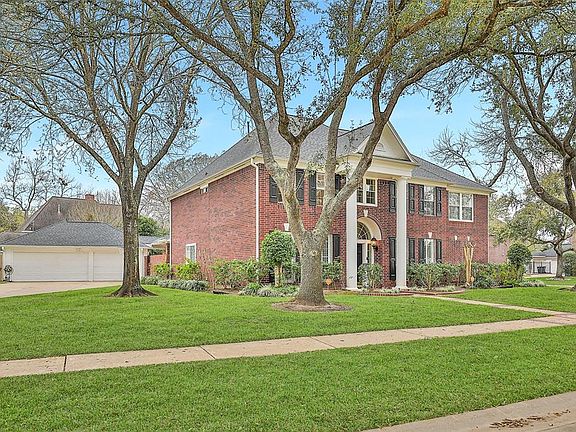 This 5/6 bedroom home occupies an enormous corner lot.