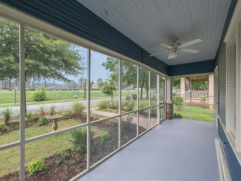 Big screen porch overlooking playing fields of Central High.