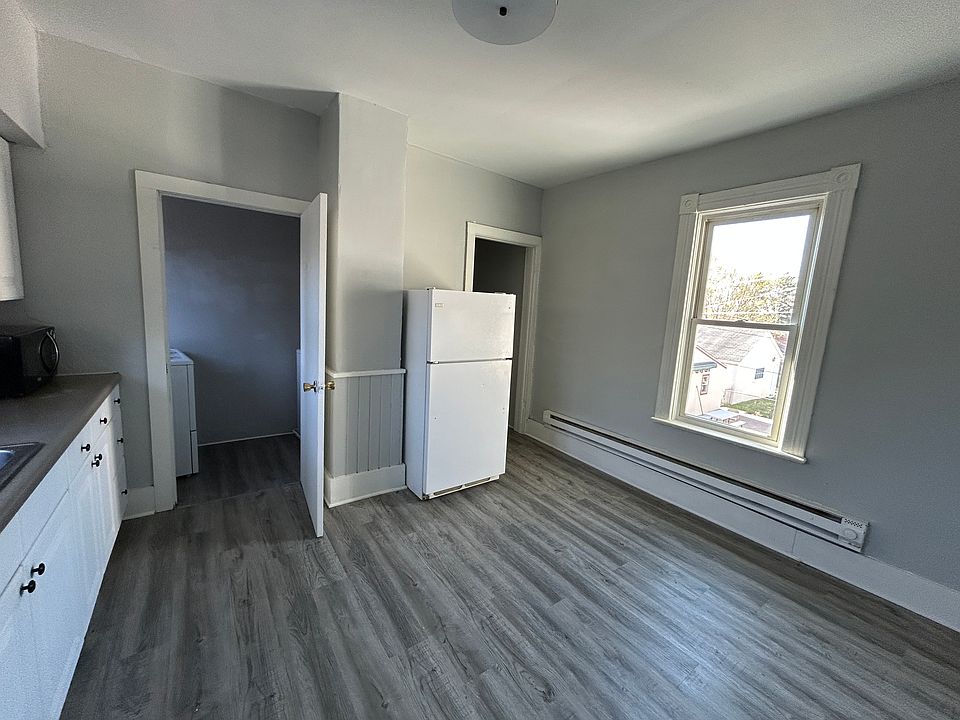 Another angle of the kitchen with laundry in left room and pantry on the right.