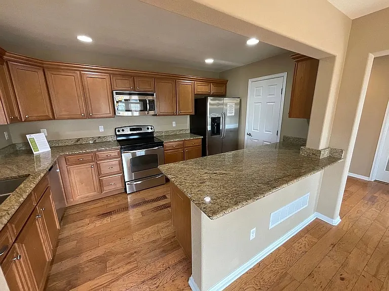 Gourmet kitchen with stainless steel appliances and granite countertops!