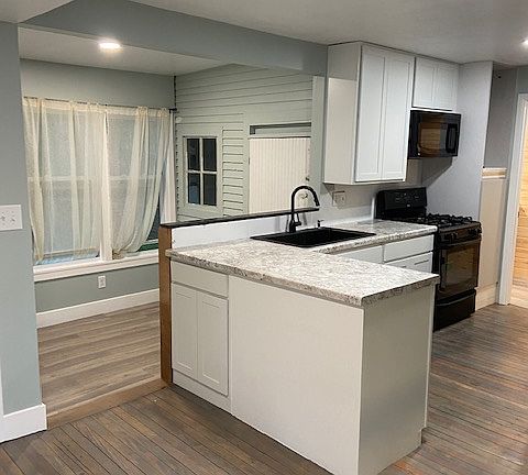 Open Kitchen/dining overlooking shaded back yard