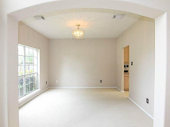 The formal dining room also has and arched entry and easy access to the kitchen.