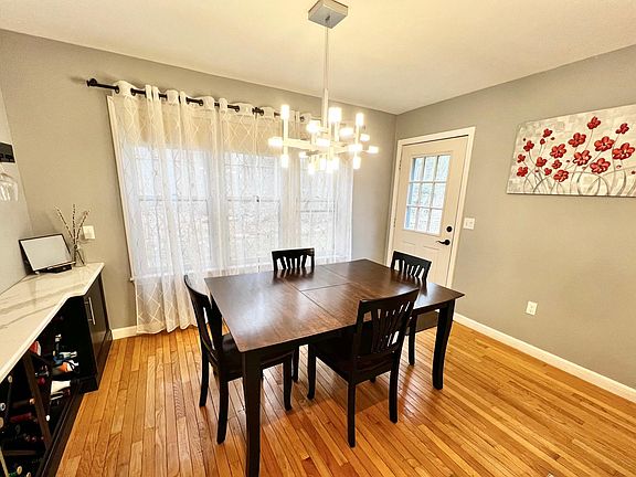 Dining room with modern lighting and built-in buffet cabinetry