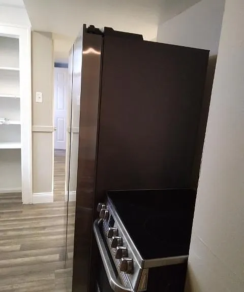 Refrigerator and electric glass top stove. 1 year plus old.