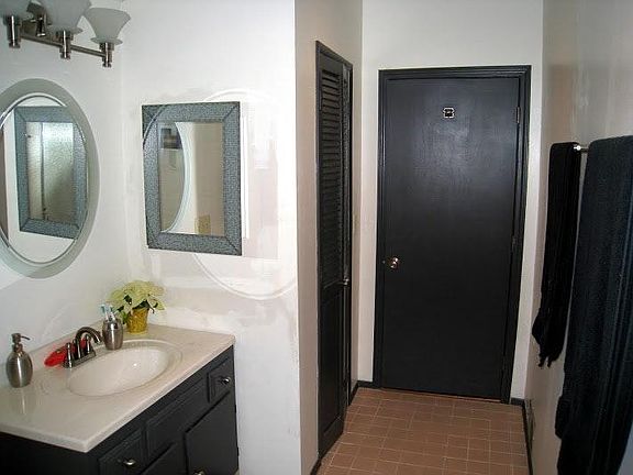 Downstairs bathroom with walk in shower and large linen clos