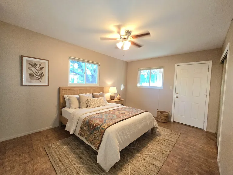 Upstairs master with door to backyard